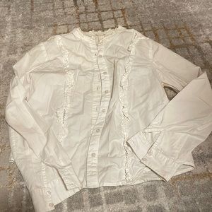 White button down with ruffle details